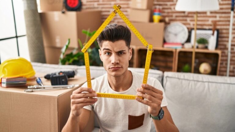 Young man thinking about house