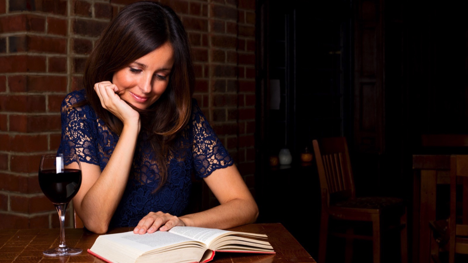 Beautiful woman reading book relaxing
