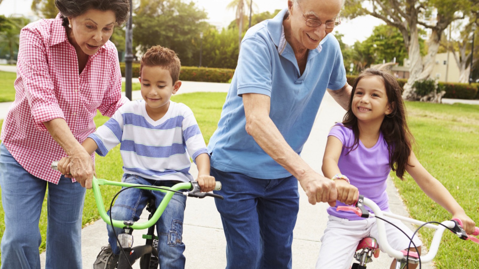 Grandparents assisting grandson and grand daughter