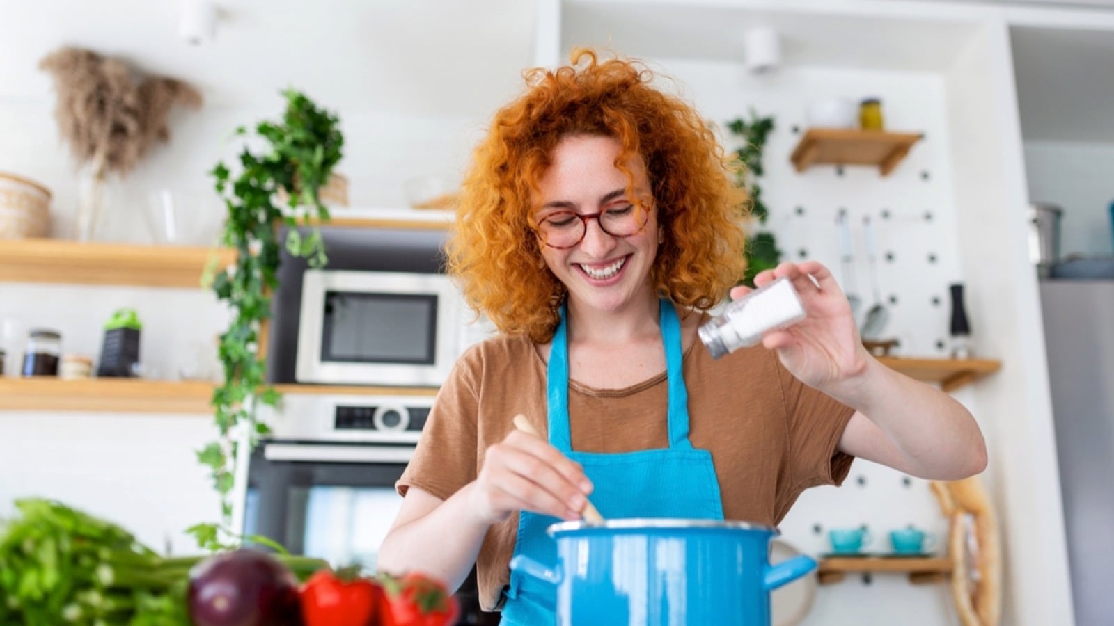 Happy woman cooking for family
