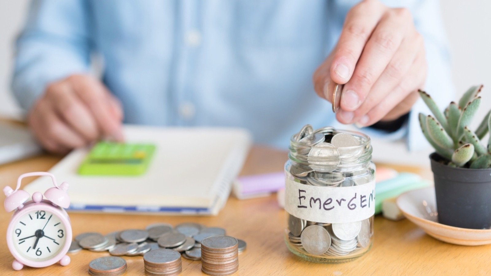Man saving money in emergency fund