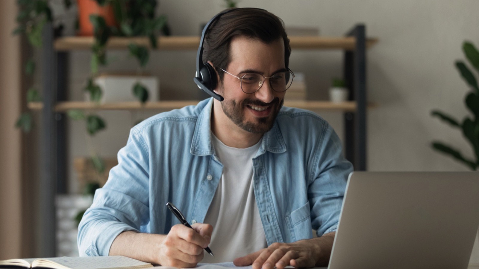 Man with laptop in meeting