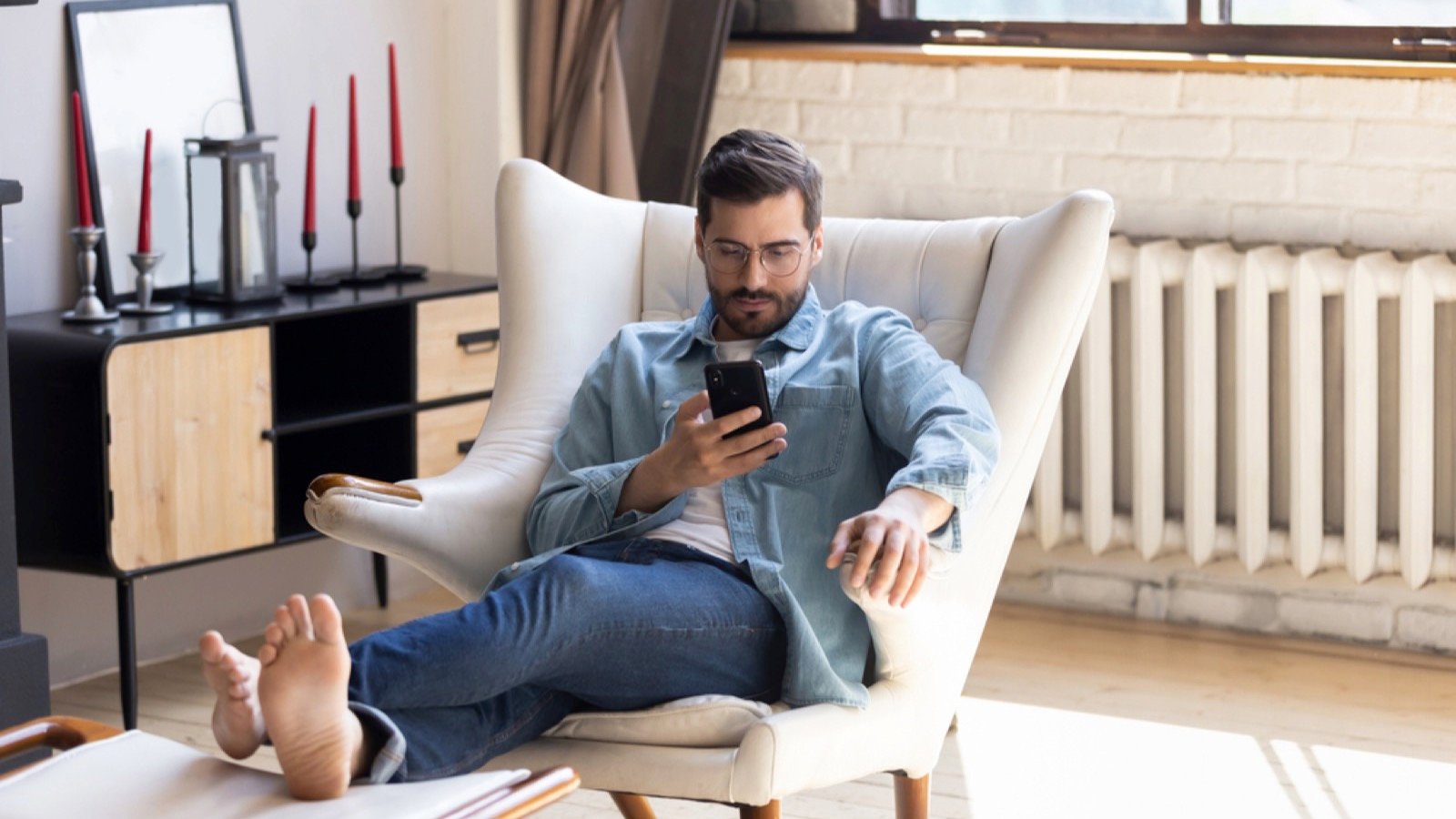 Man with mobile thinking