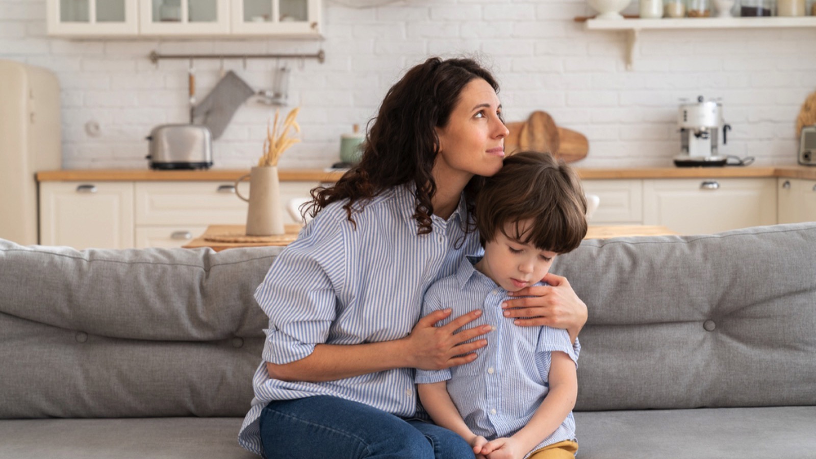Mother with son feeling guilty