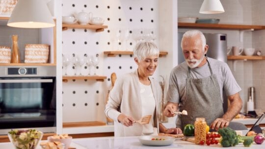 Old couples cooking