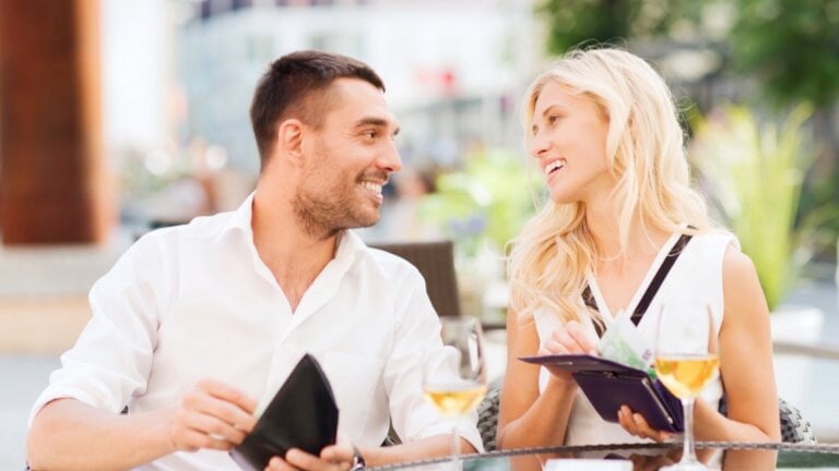 Paying bill in cash at restaurant