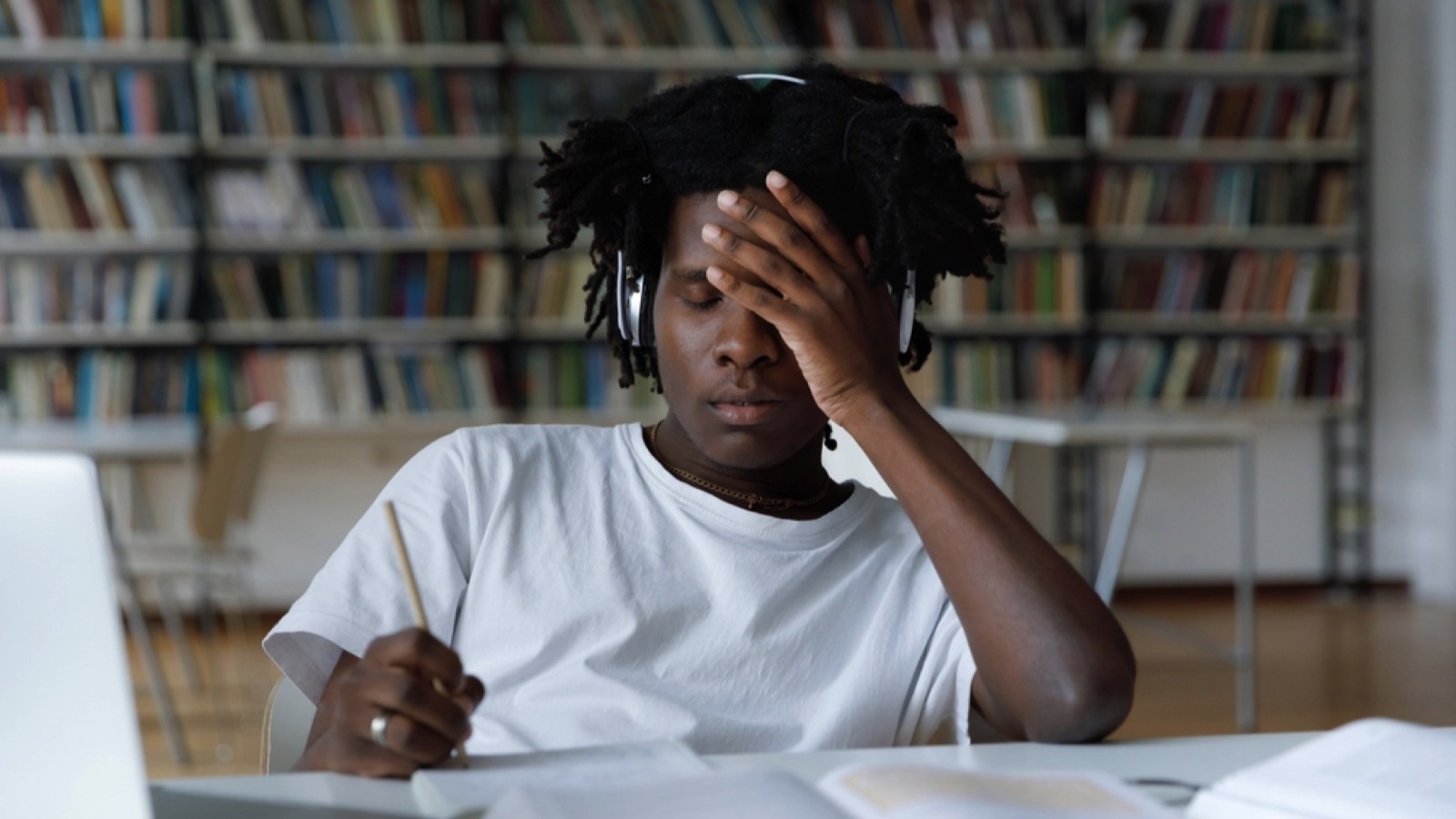 Stressed teen in library