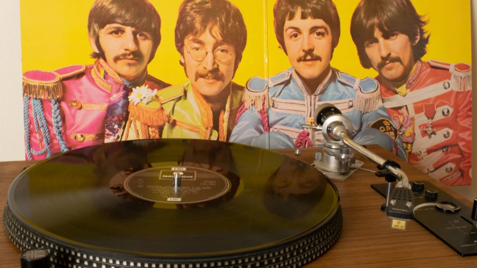 Manchester UK. January 6, 2020. Playing Sgt Pepper's Lonely Hearts Club Band vinyl record by the Beatles on a direct drive record player. Inner cover with photograph of the Beatles