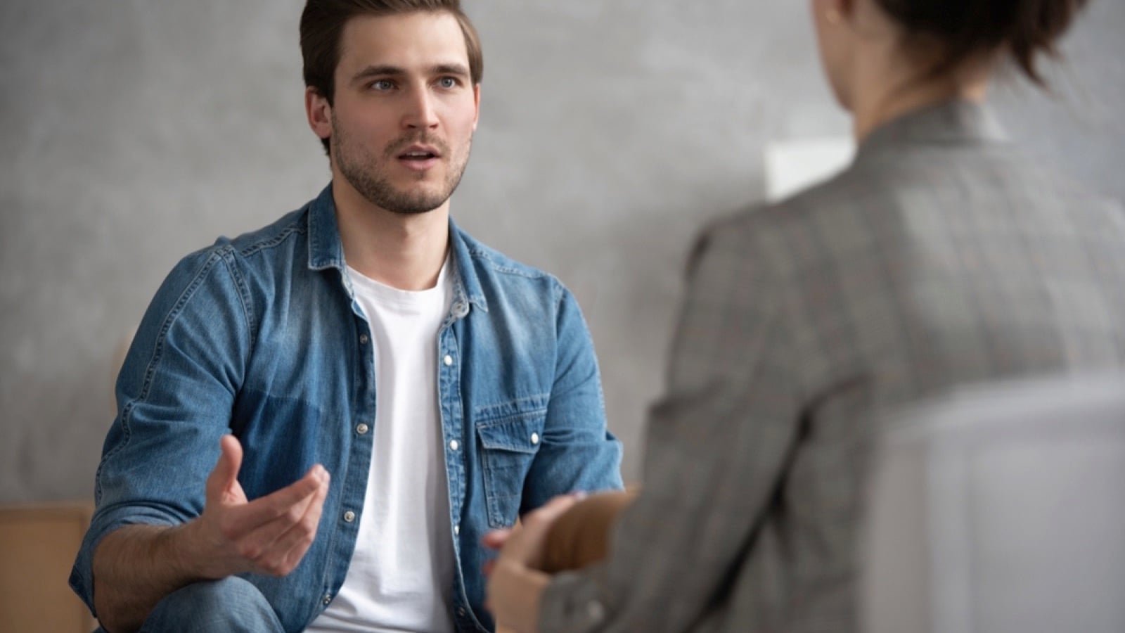Therapist talking with patient