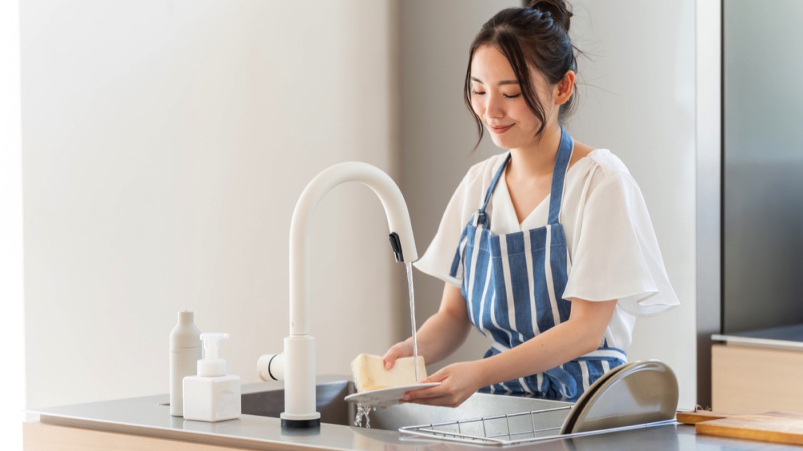 Woman cooking and cleaning