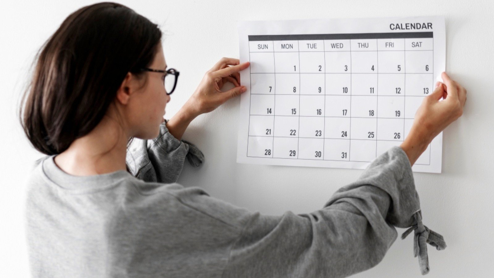 Woman marking in calendar