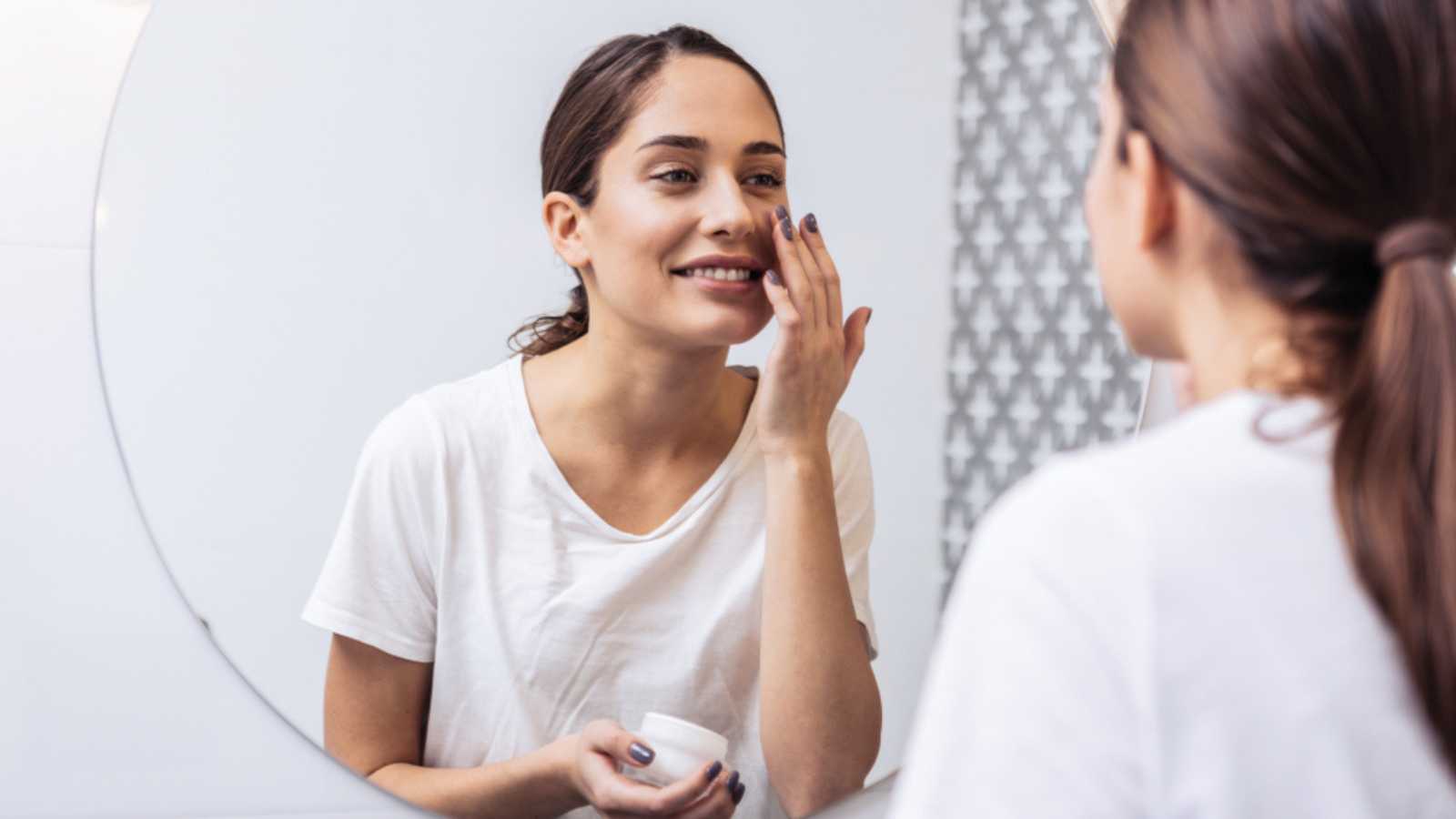 Woman using face cream
