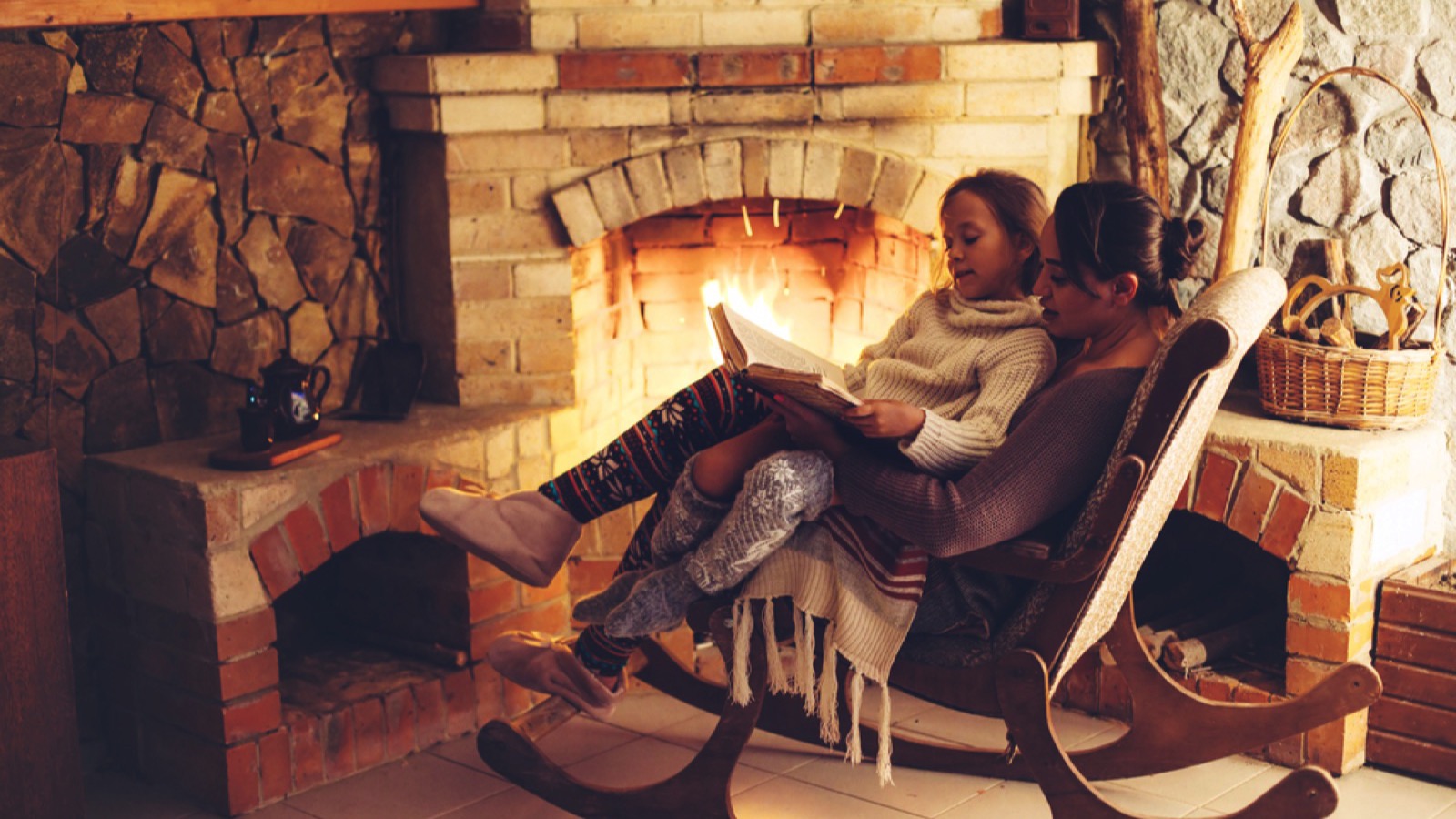 Woman with child reading book