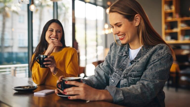 Woman with her friend meeting for coffee