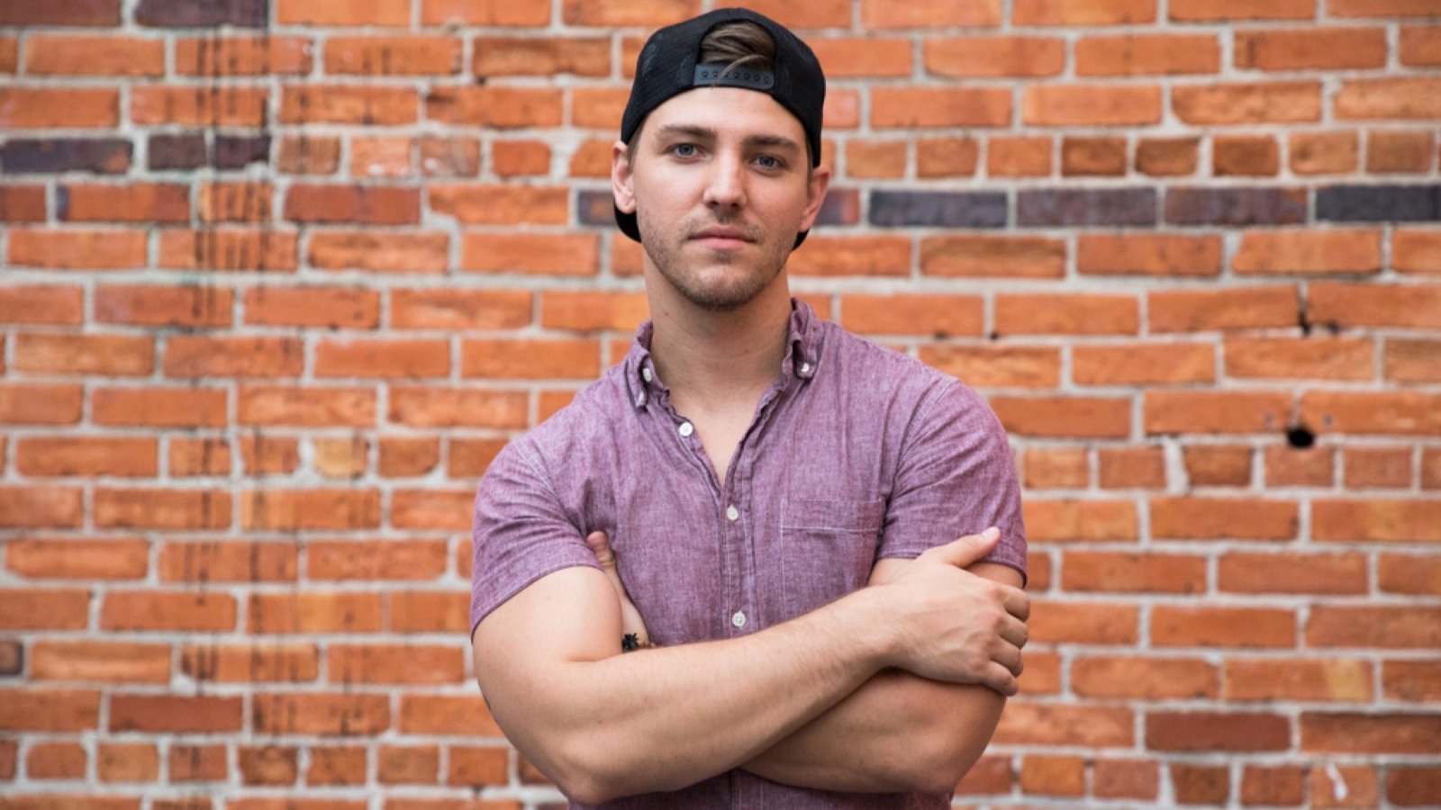 Young man wearing Backward Cap