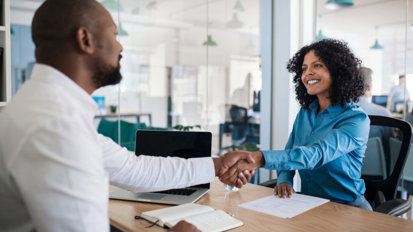 African man shaking hands with employee