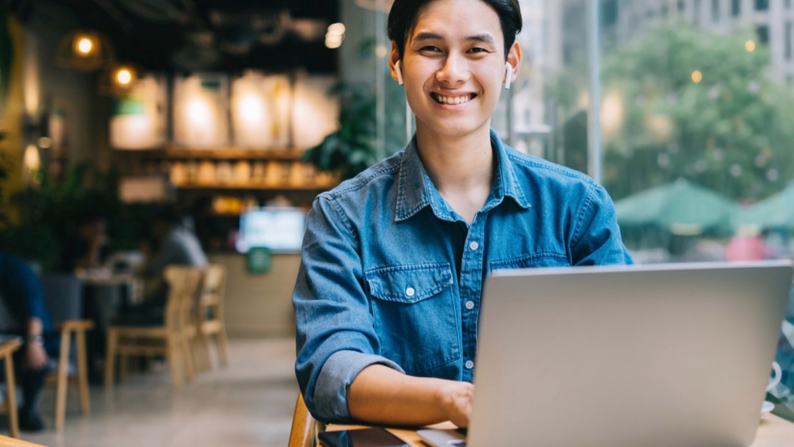 Asian man working with laptop