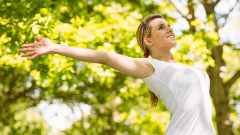 Beautiful woman enjoying walking in park