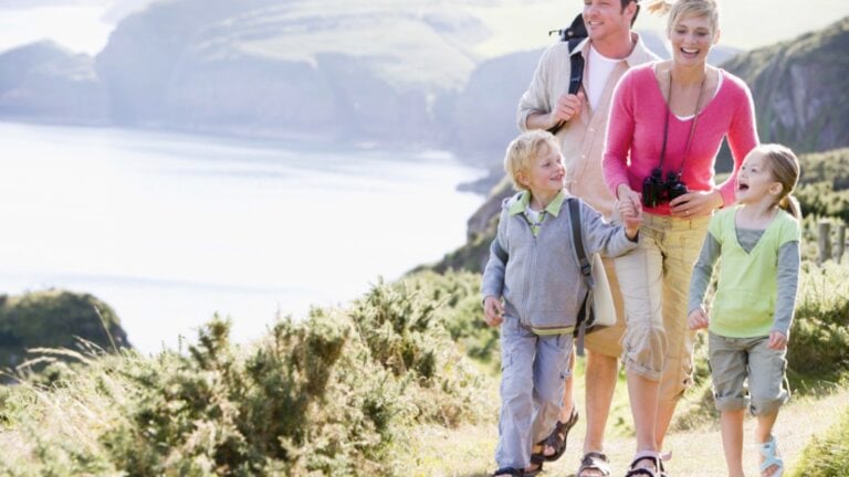 Family walking on cliff
