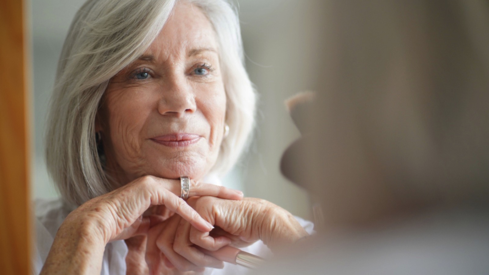 Grandmother looking in mirror
