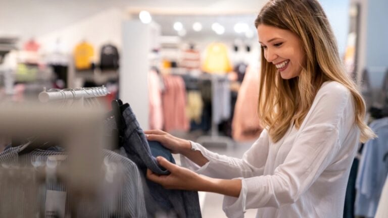 Happy woman buying jean