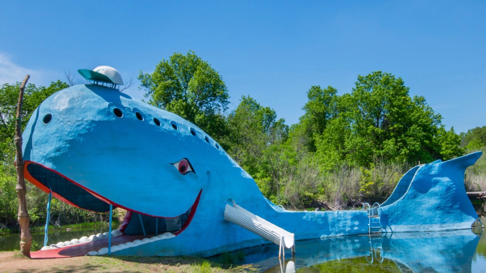 Iconic Blue Whale floating in Natures Acres pond, on Route 66