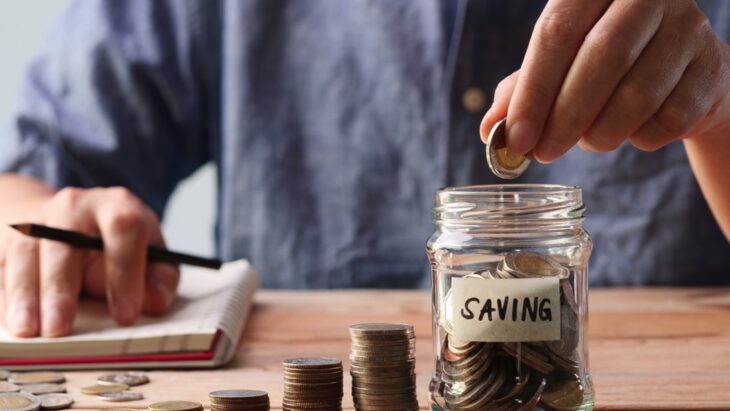 Man saving coins-Smart Saving Tips