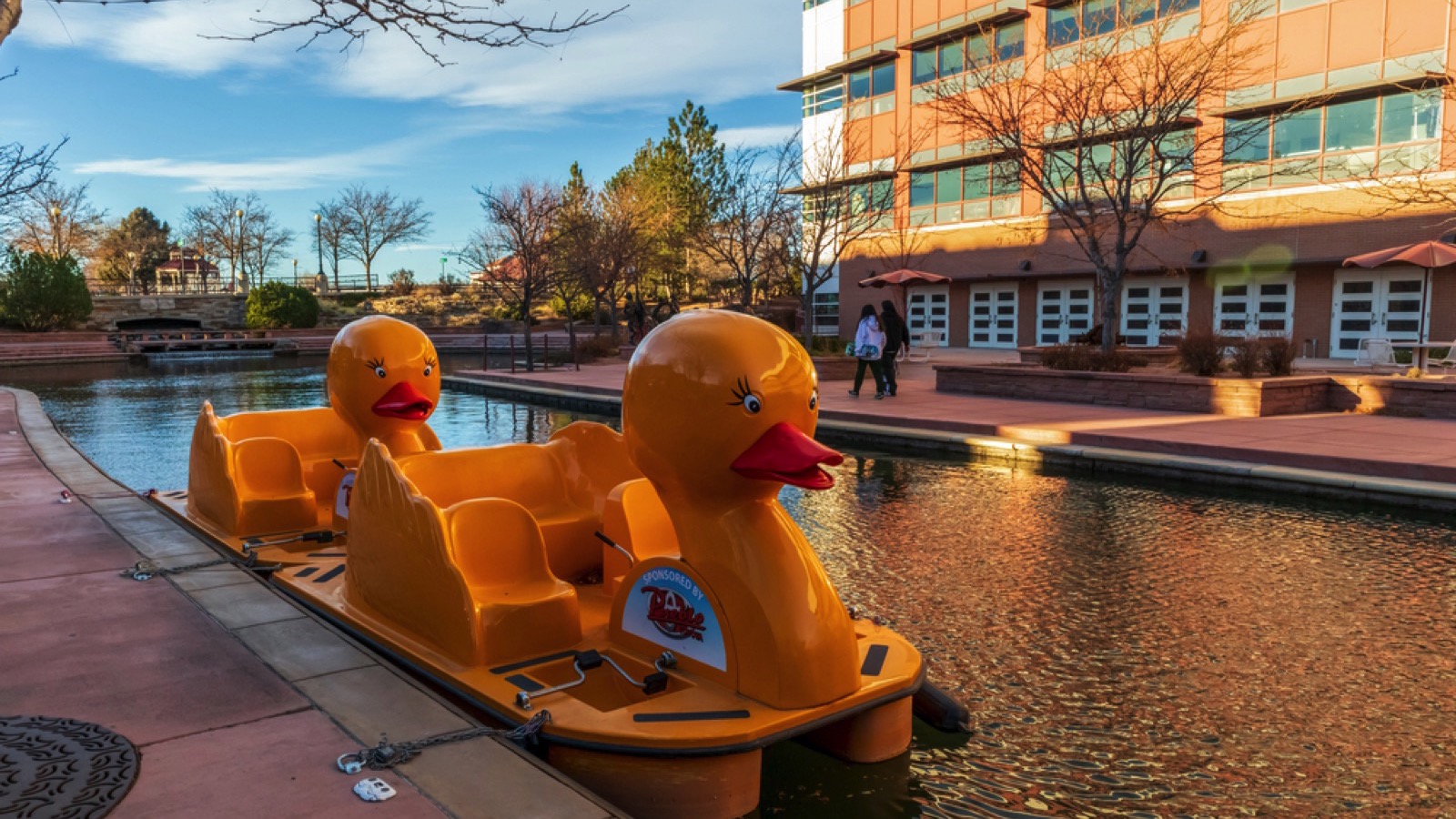 Pueblo, Colorado - November 15, 2020: Yellow duck paddle boats in Historic Arkansas Riverwalk of Pueblo, Colorado