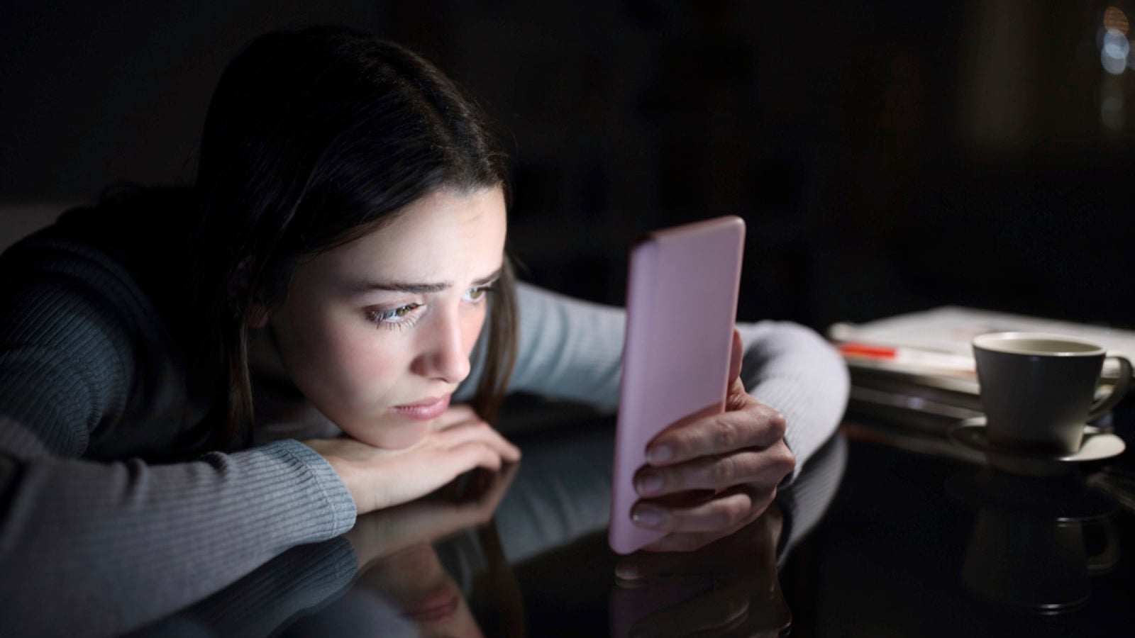 Teen using mobile at night
