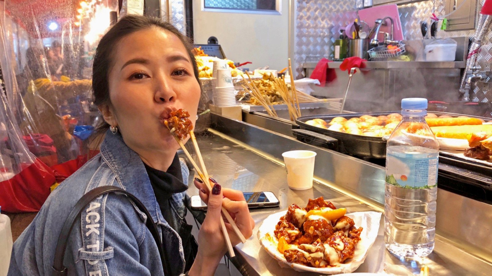 Traveler eating street food