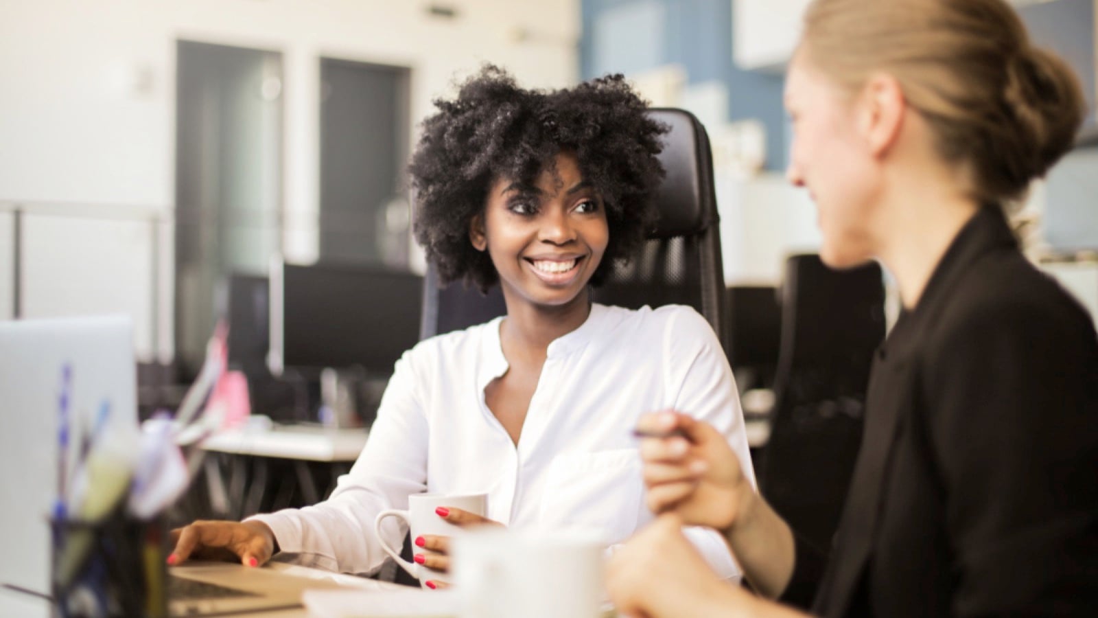 Woman discussing with co worker