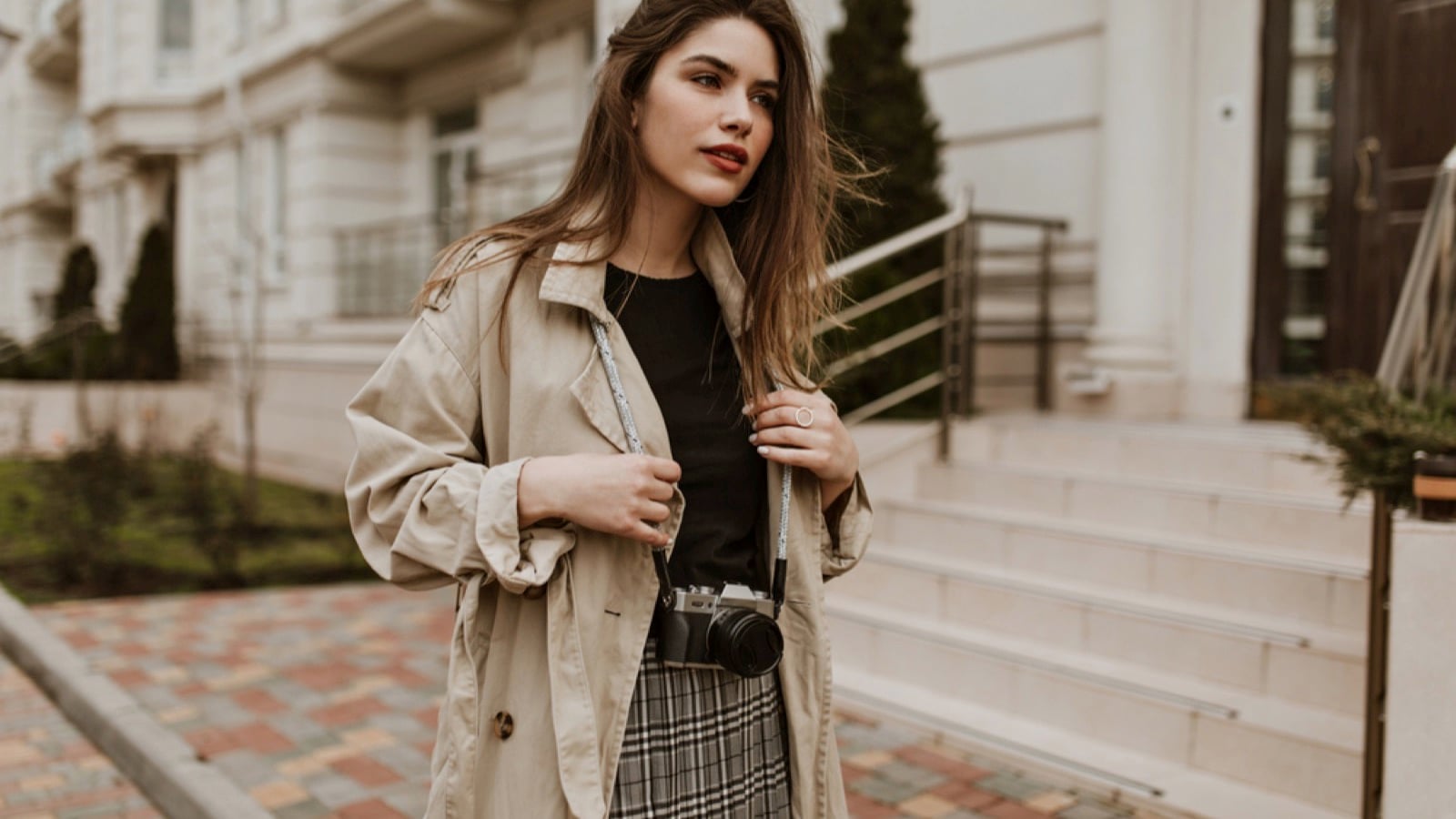 Woman wearing coat and skirt