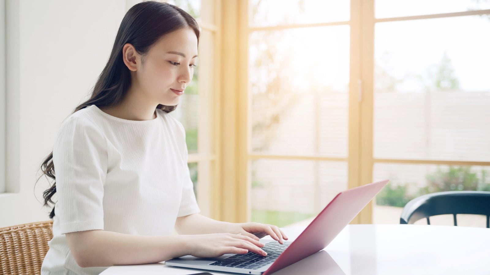 Young asian woman using a laptop