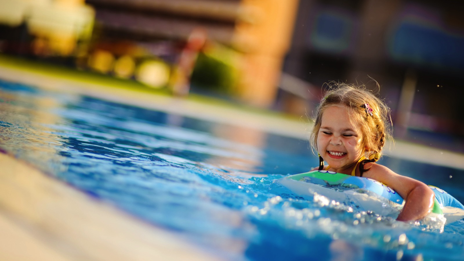 Young little girl in swimming pool