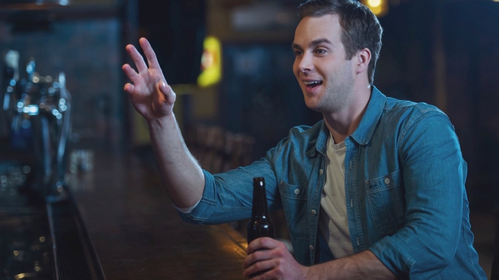 Young man siting in bar counter