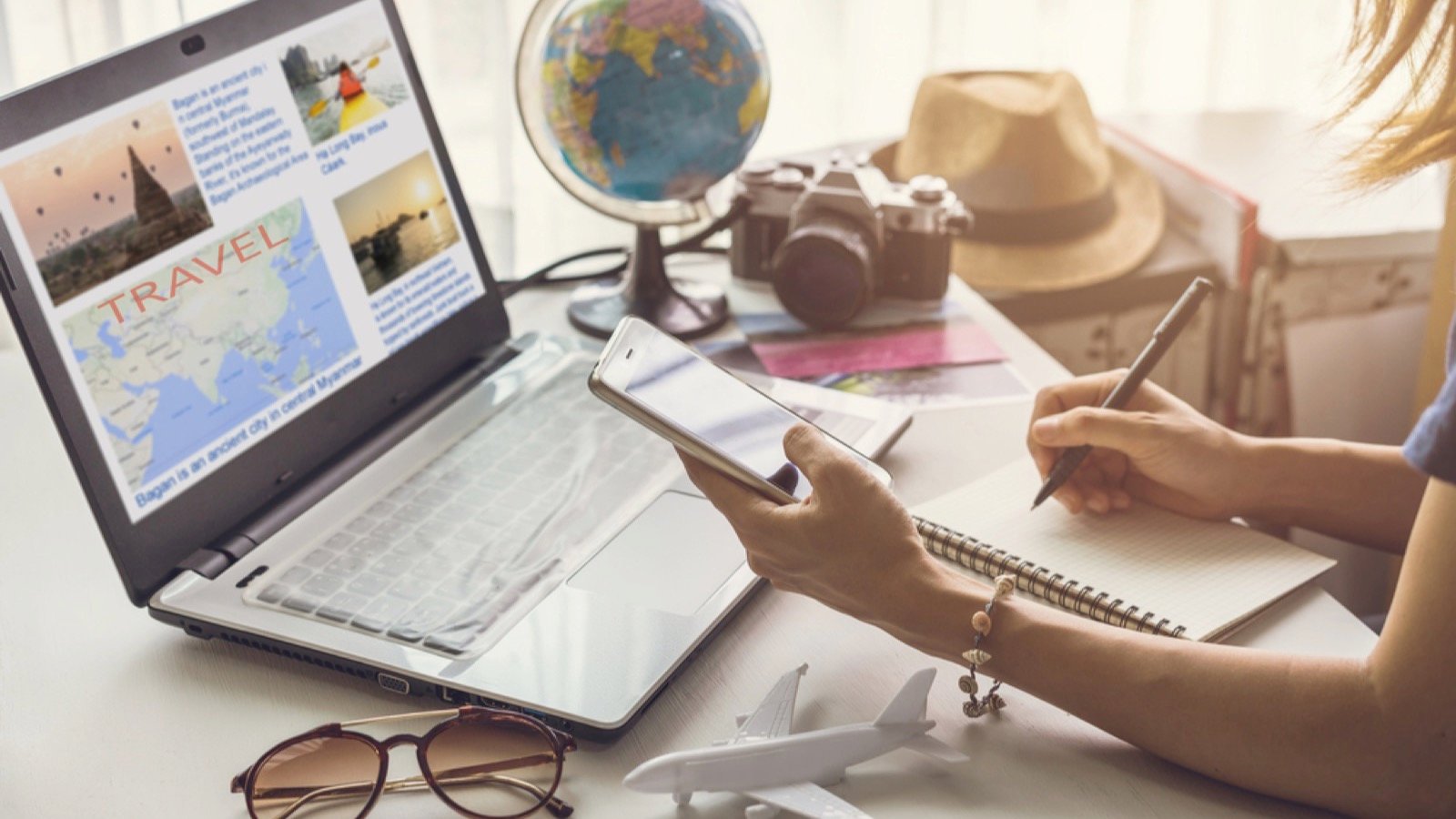 Young woman planning vacation trip