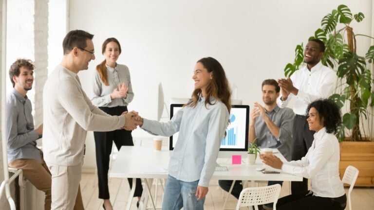 career center, Boss,Shaking,Hand,Of,Young,Shy,Woman,Congratulating,Successful,Employee