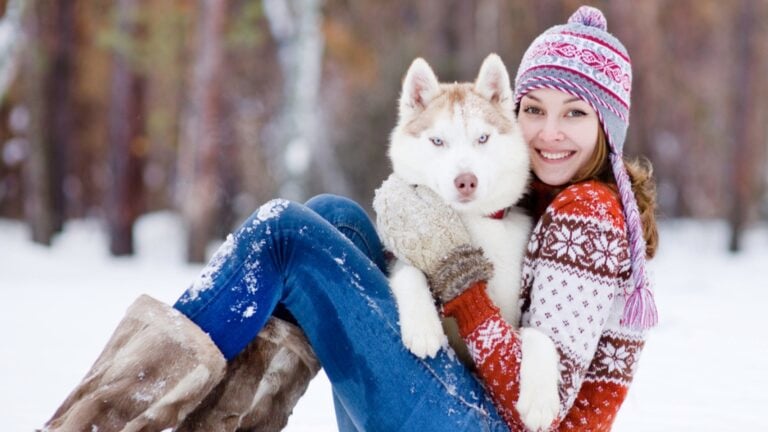 Beautiful woman with Siberian dog