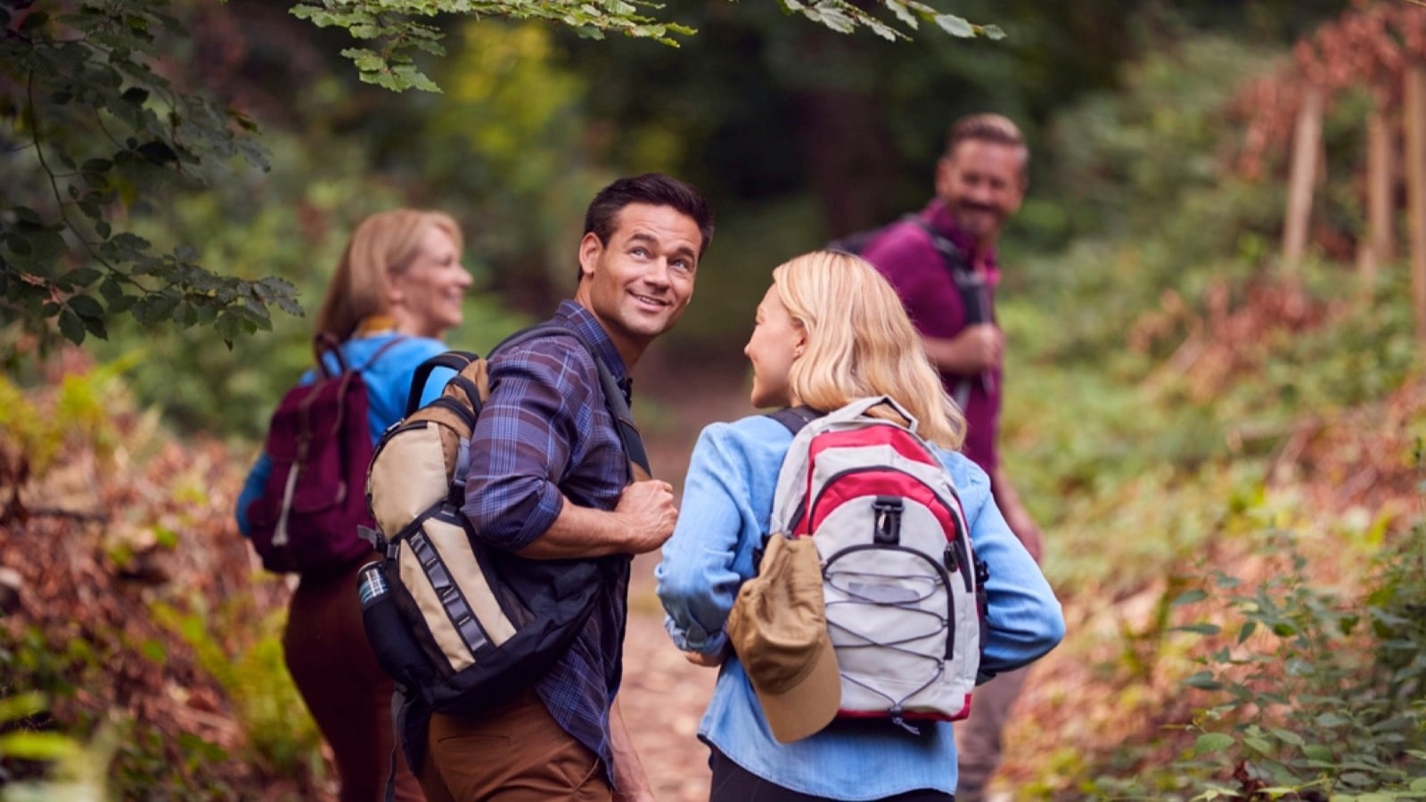People walking through forest
