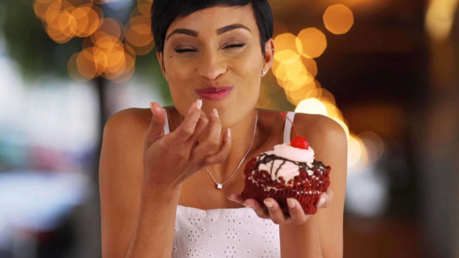Woman eating cupcake