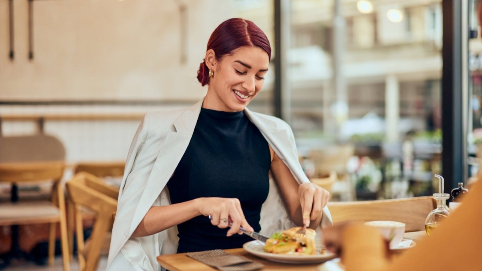Woman eating new food in restaurant