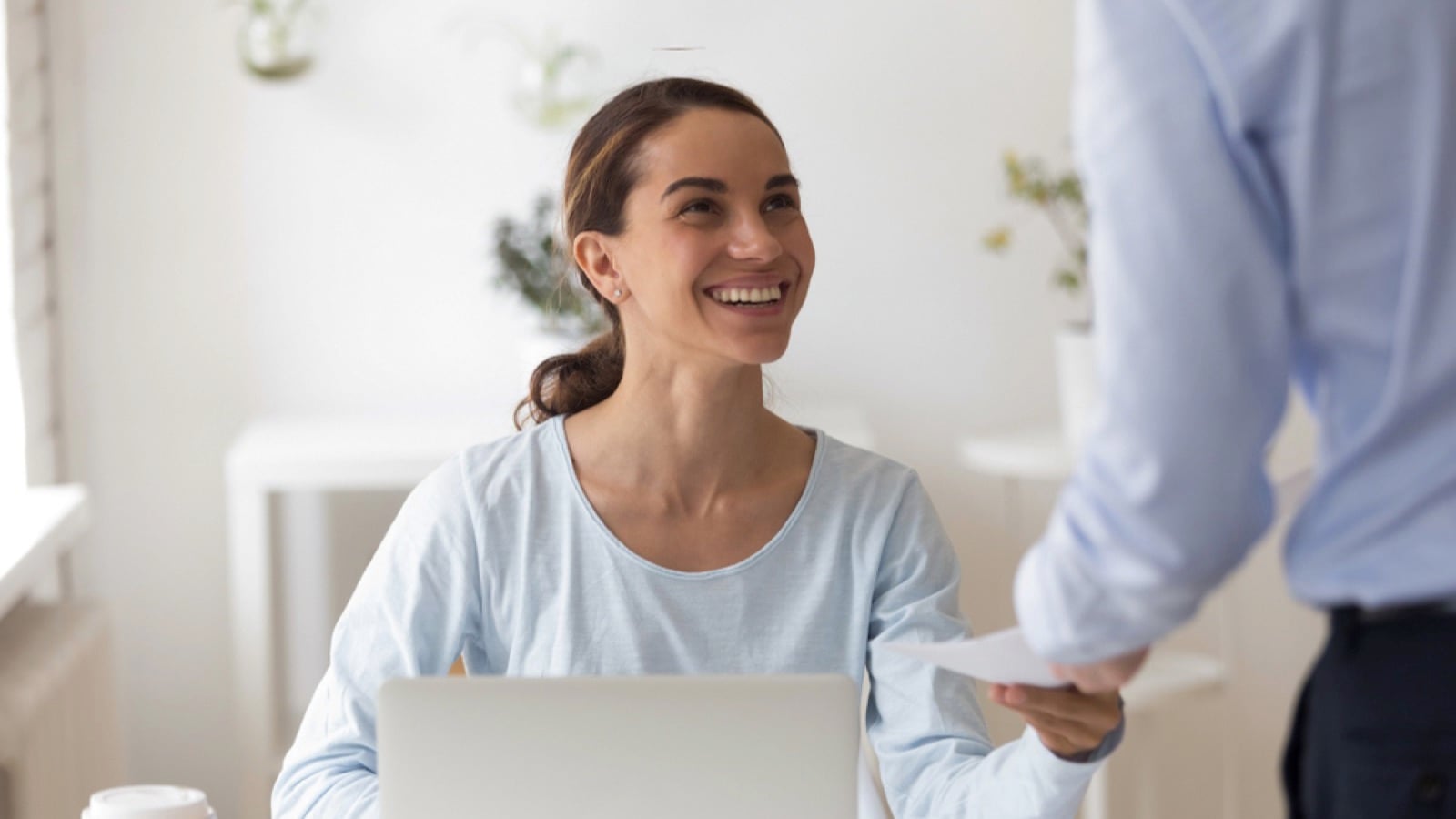Woman getting reward from manager
