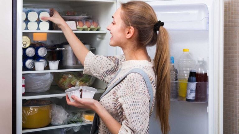 Woman looking in fridge