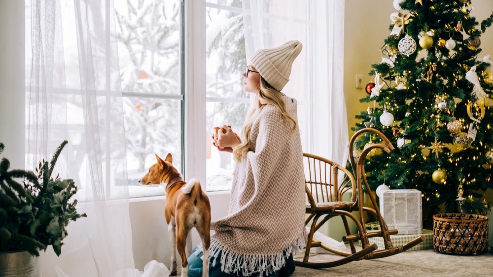 Woman near window with dog