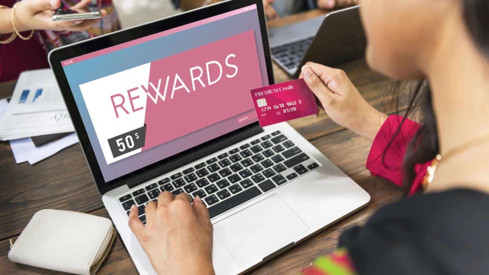 Woman using credit card for rewards