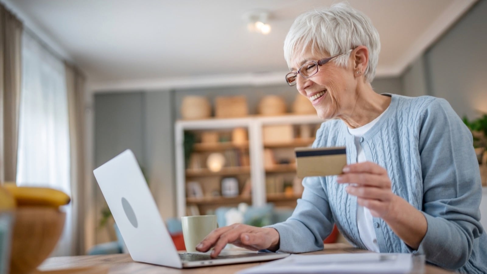 Woman using credit card to buy