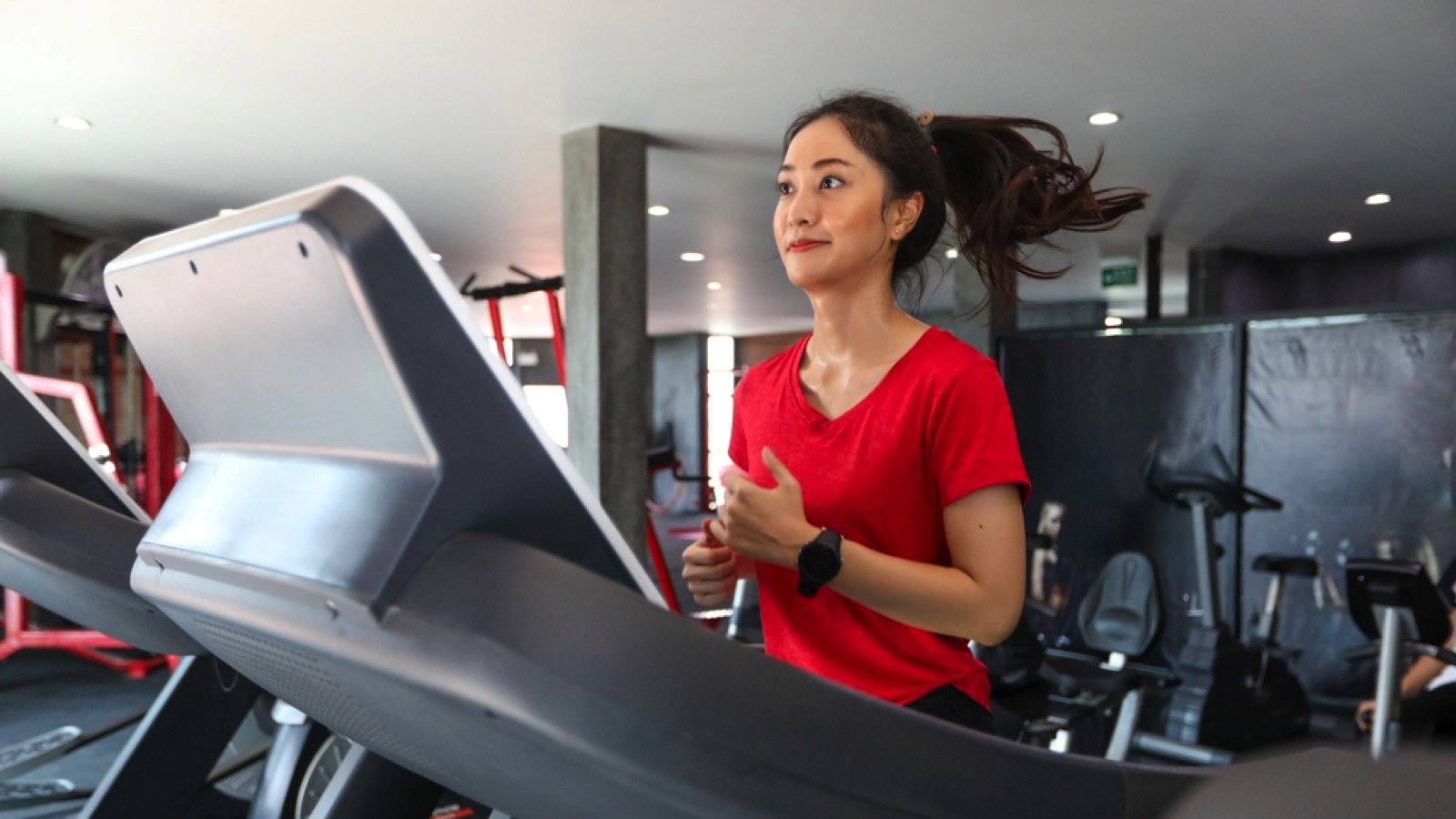 Woman using treadmill, selfcare