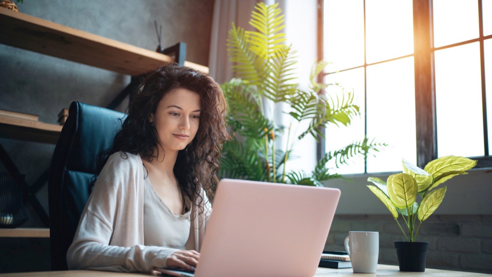 Woman working at home in remote workspace