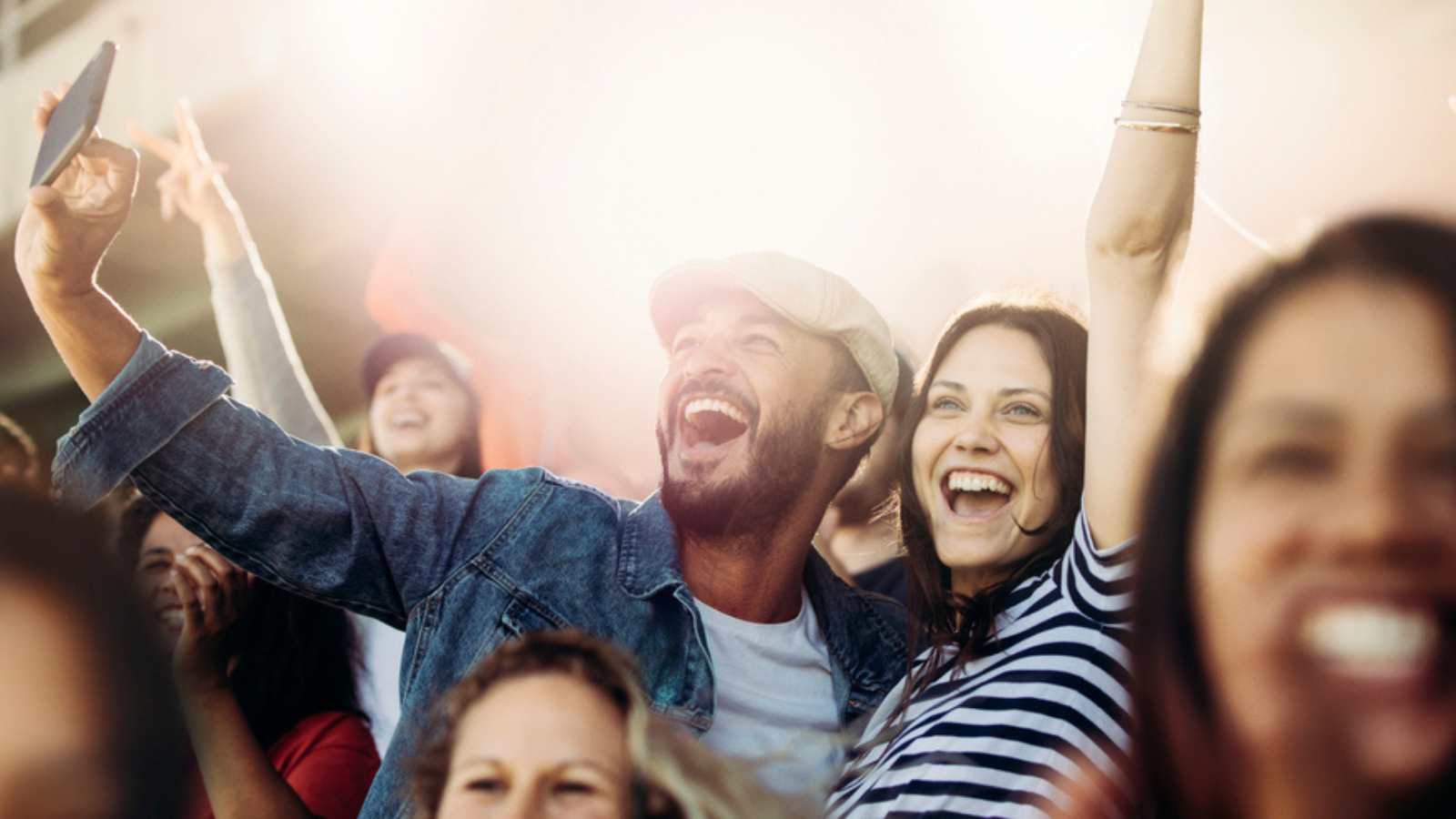Couples watching sports game