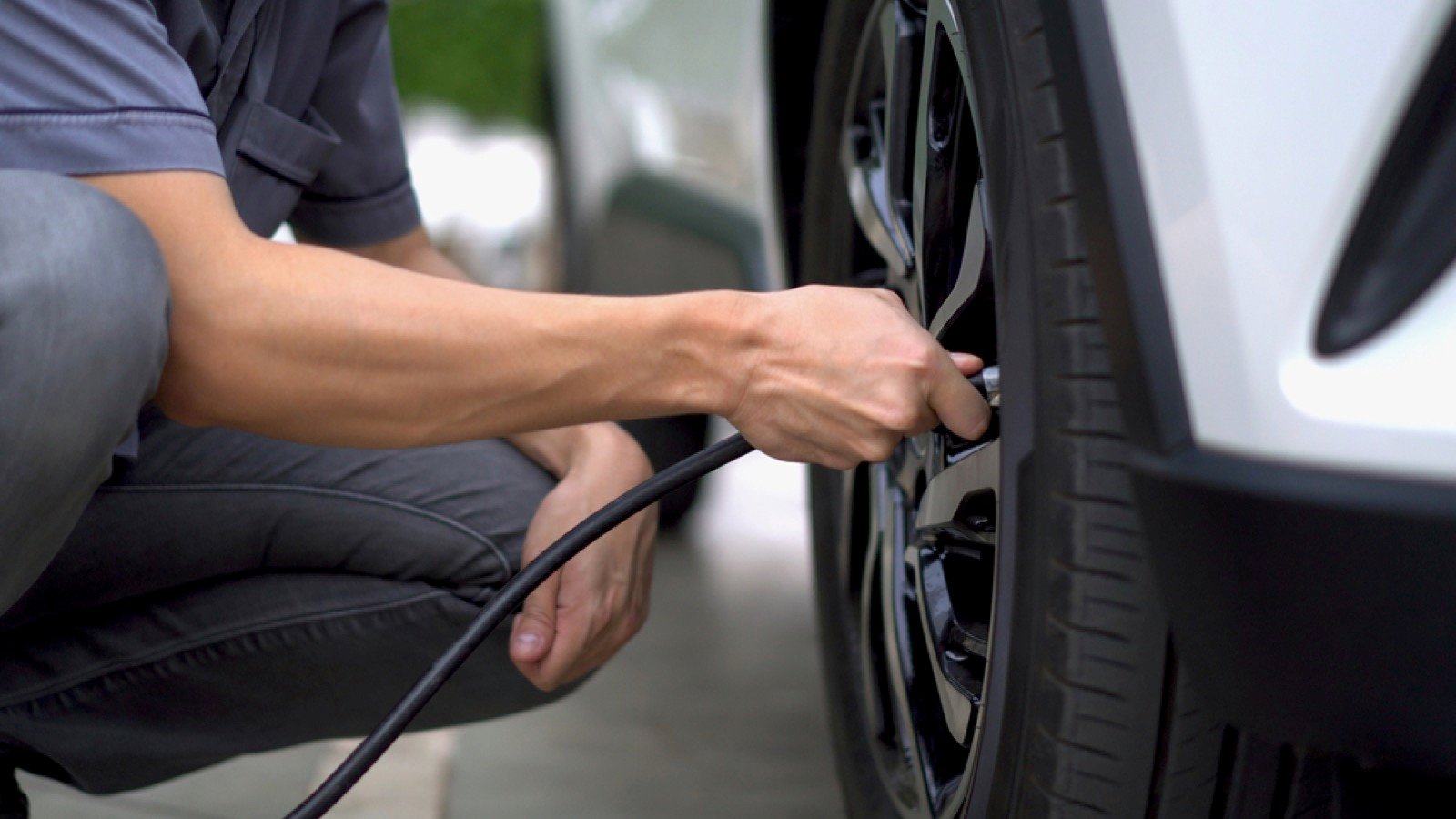Man filling air in the tires